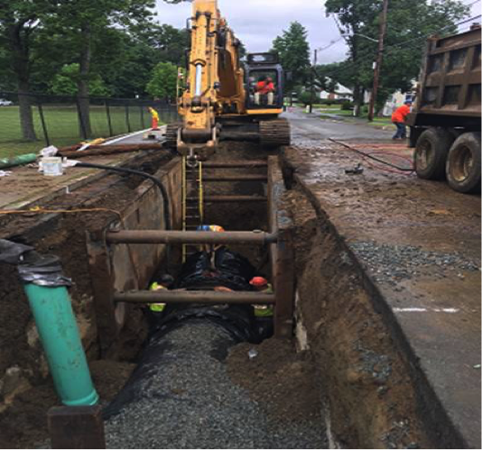 MWRA: Installing 48-inch restrained joint pipe on Oak Street outside school Stoneham